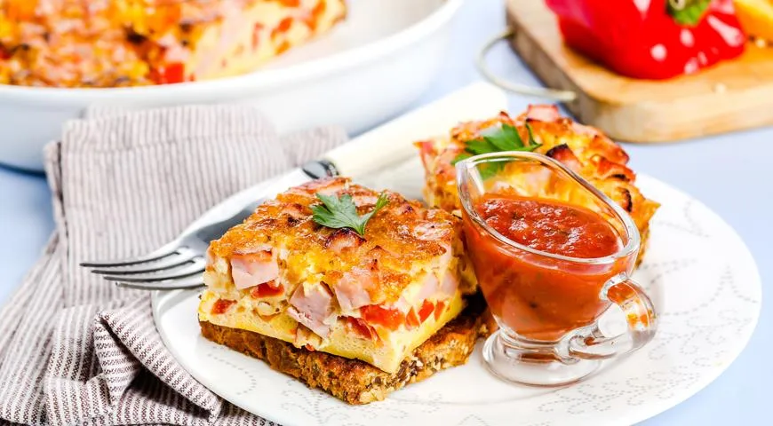 Омлет із шинкою та овочами: ніжний сніданок з фото та покроковим рецептом 1 Омлет із шинкою та овочами: ніжний сніданок з фото та покроковим рецептом 1